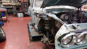 Ford Zodiac front wings being refitted