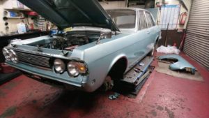 Ford Zodiac front wings being refitted